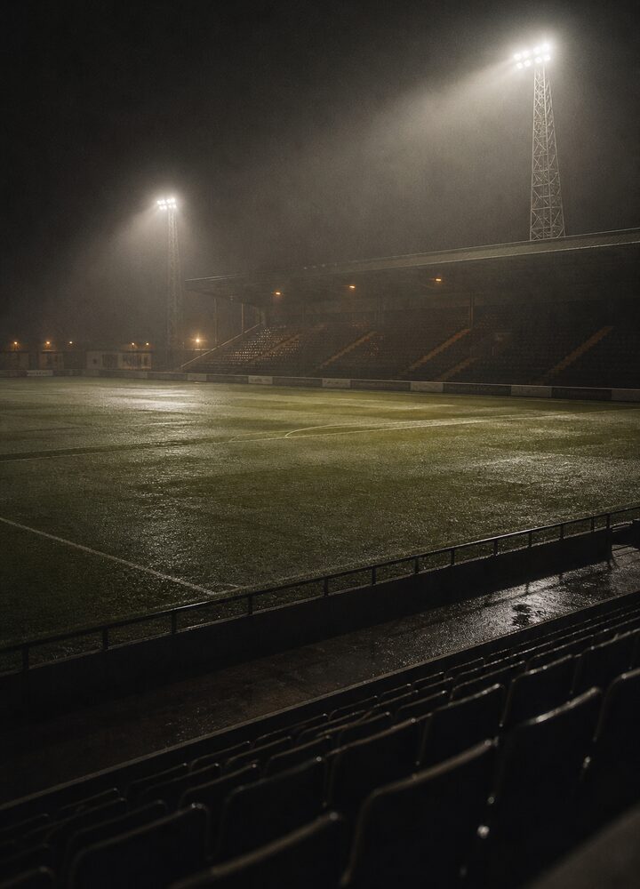 Floodlit stadium at night